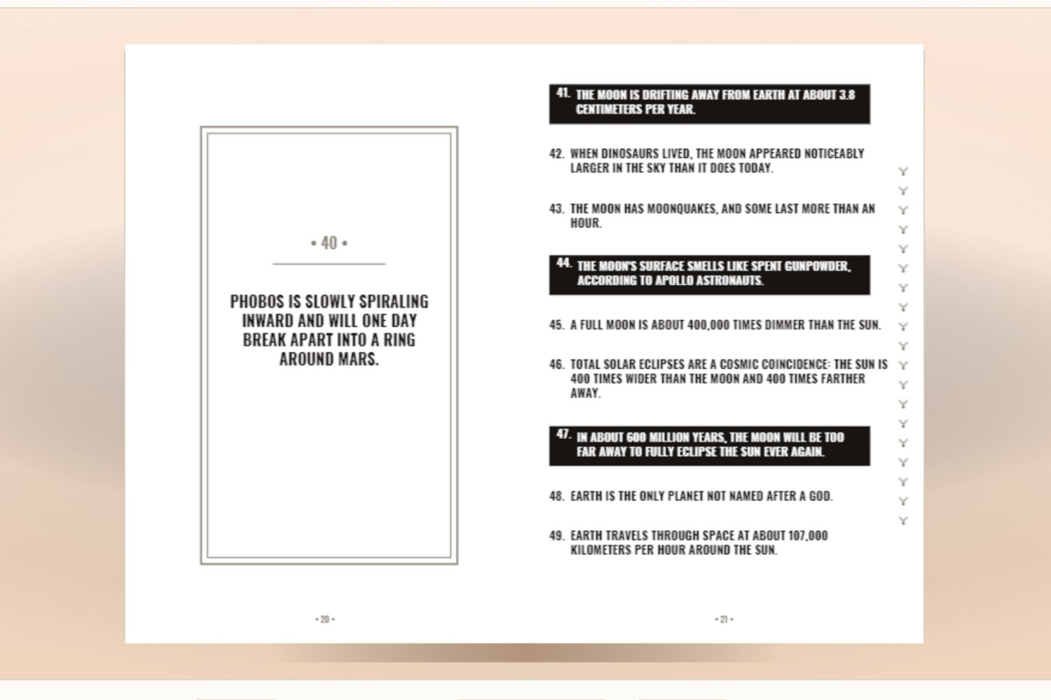 A book built by Fact Book Studio open to an interior spread: milestone card left, numbered facts with call-out boxes right
